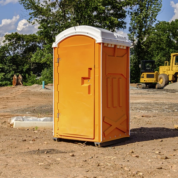 what is the cost difference between standard and deluxe porta potty rentals in Harvey ND